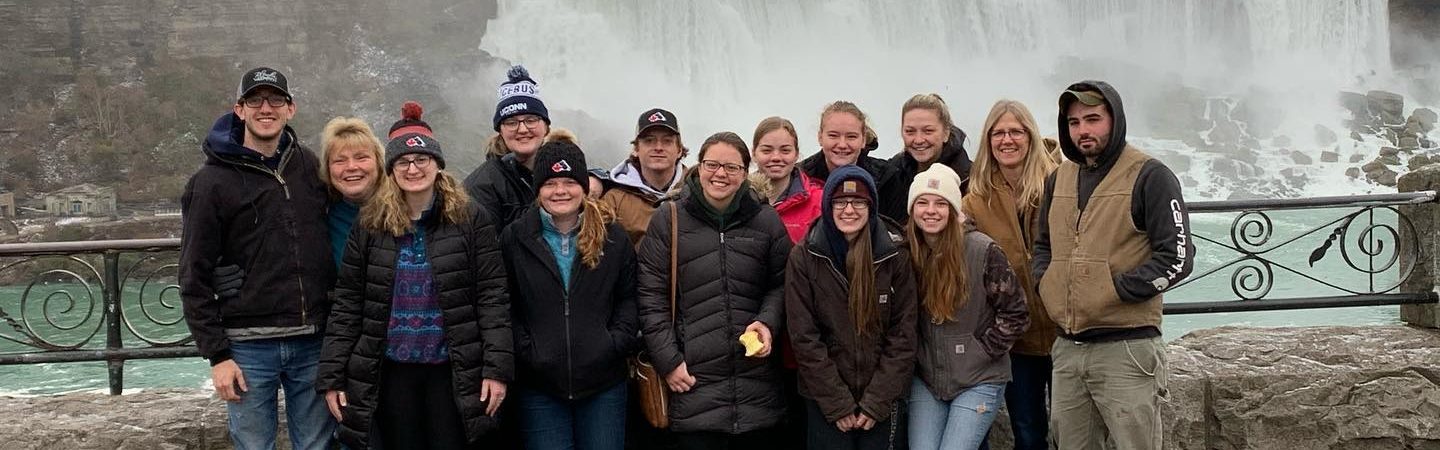 club photo in front of Niagra falls Canada